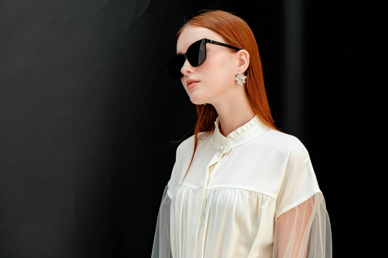 an image of a woman with sunglasses on