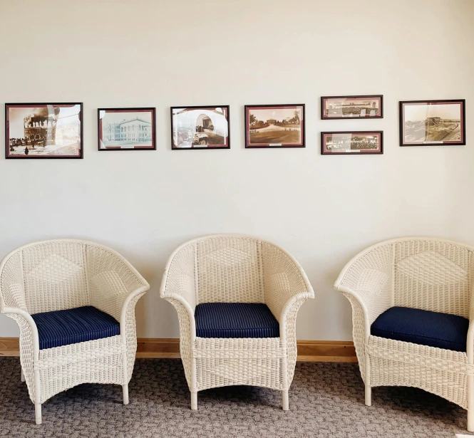 a room with chairs lined up against a wall