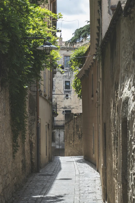 the alley way leads up into the town