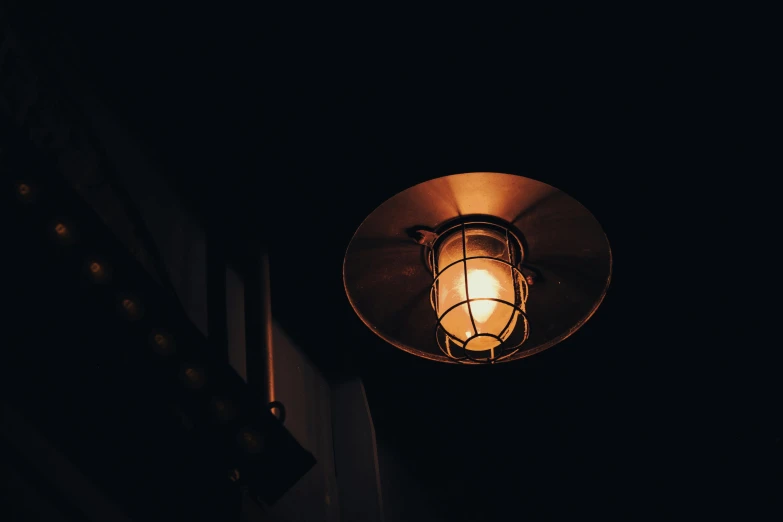 a lamp inside a dark room with no lighting on