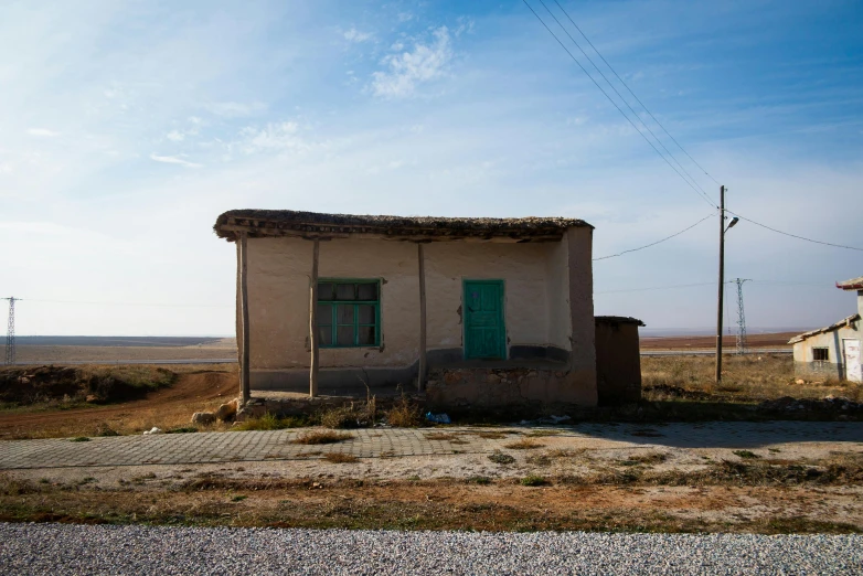 an outhouse sitting in the middle of nowhere