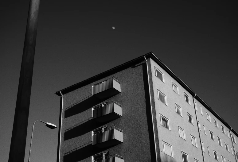 an apartment building with balconies on the sides of it