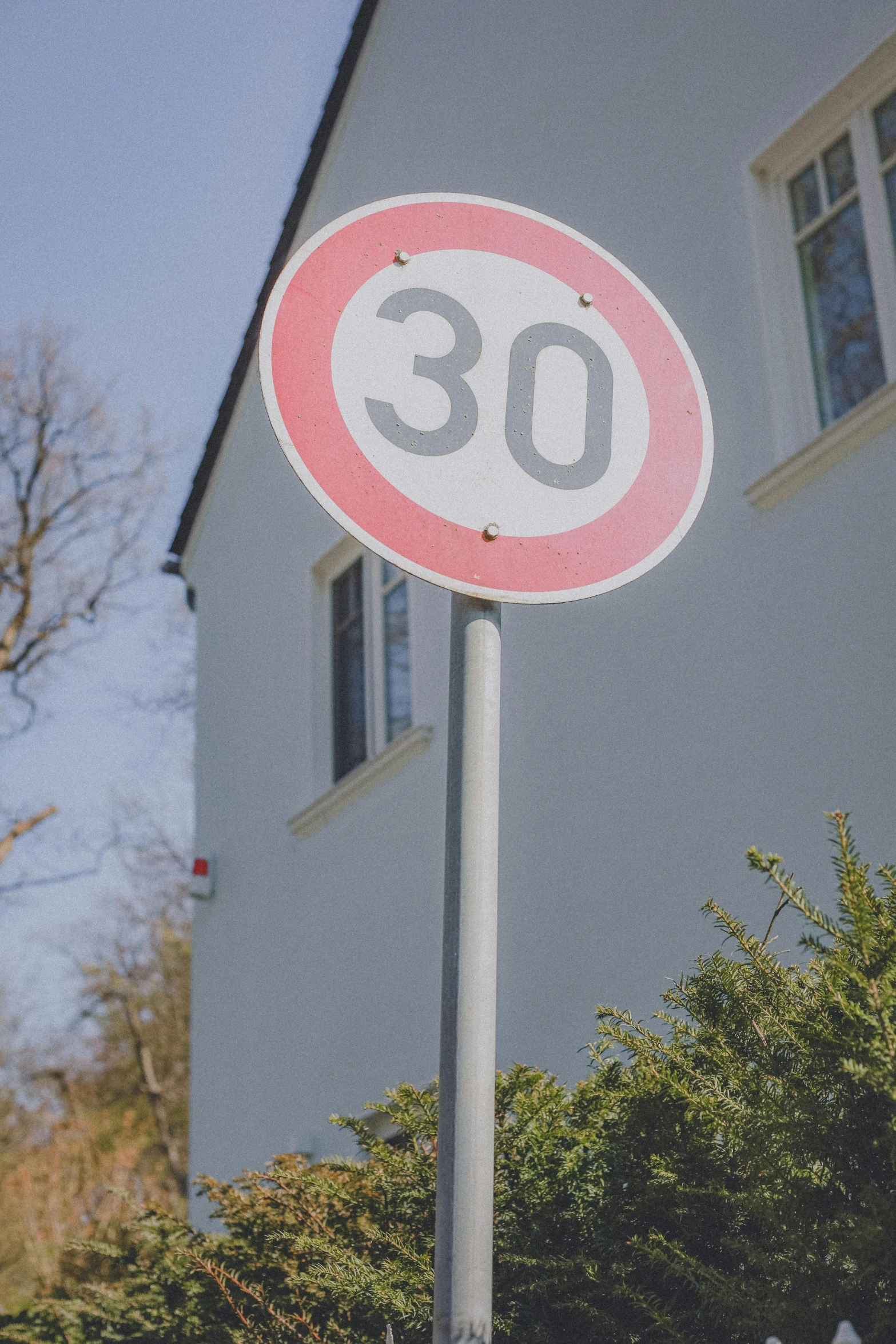 a street sign on the corner near a building