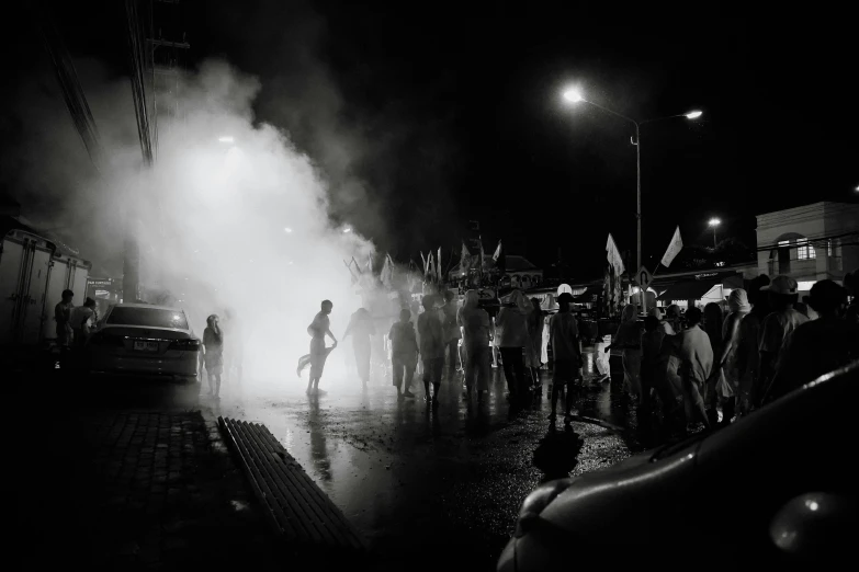 a couple standing next to a group of people on a street