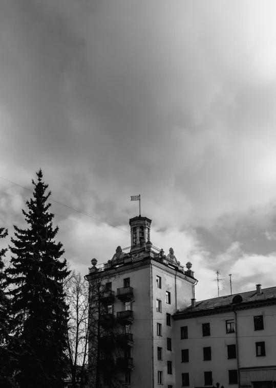 a tower with a clock on it against a cloudy sky