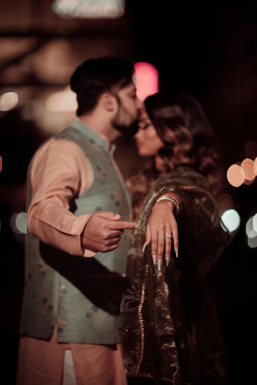 a bride and groom are standing close together