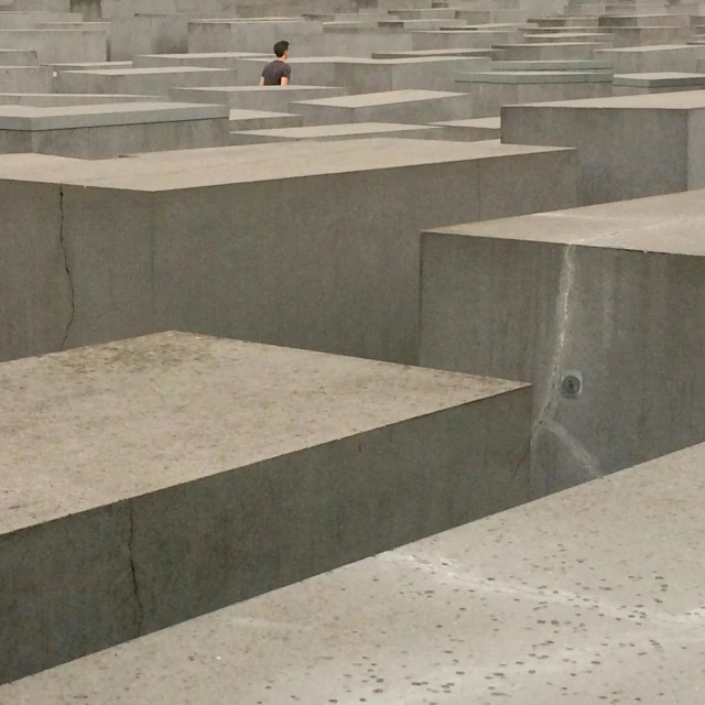 a person in a large concrete area is observing for people