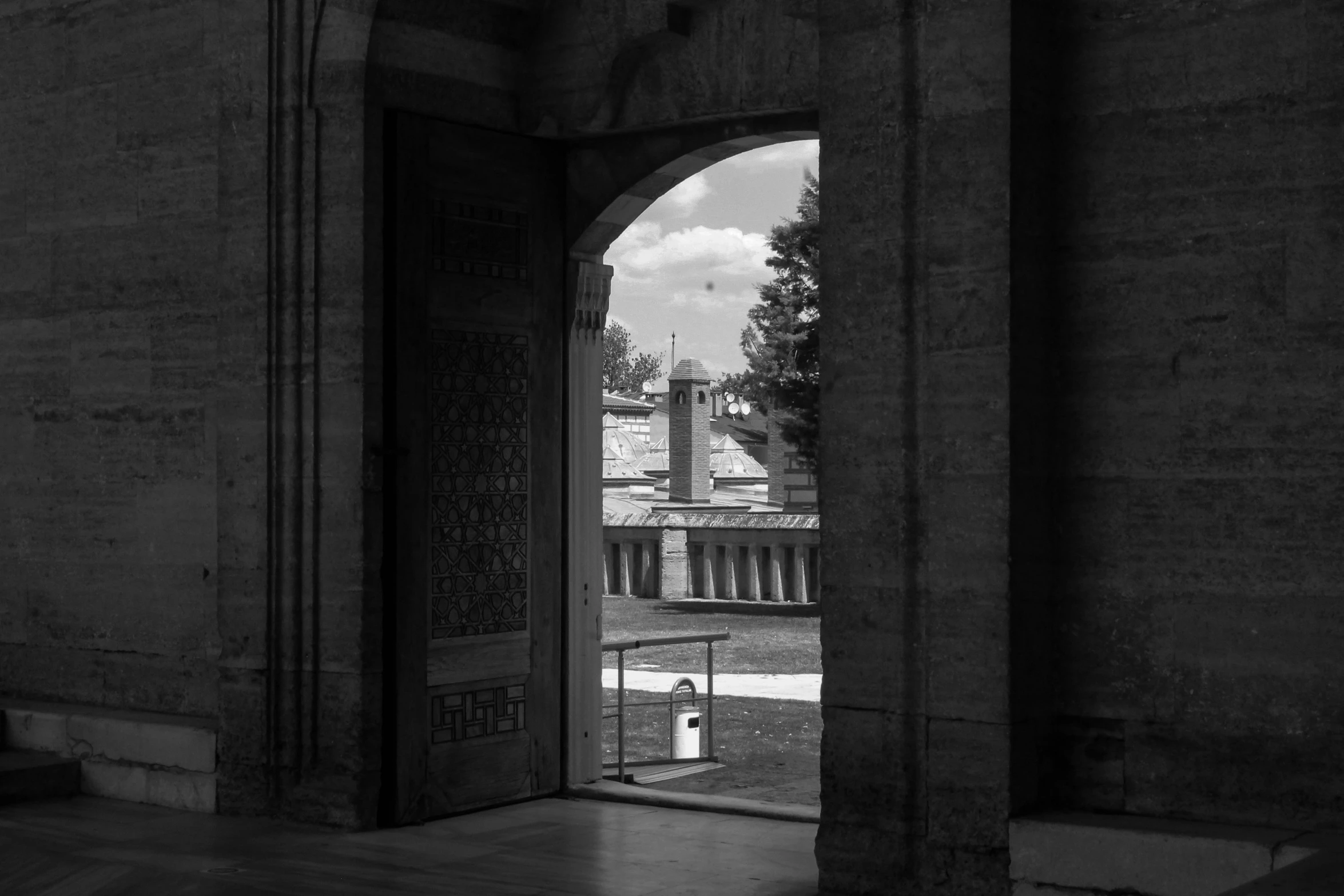 a door opening to a hallway and a view out the outside