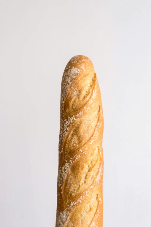 a big round piece of bread on a white table