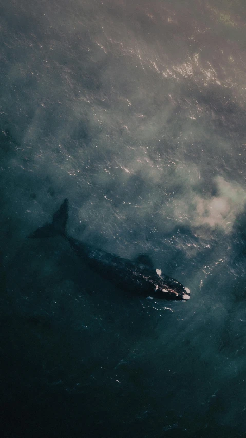 a boat is floating alone in the ocean