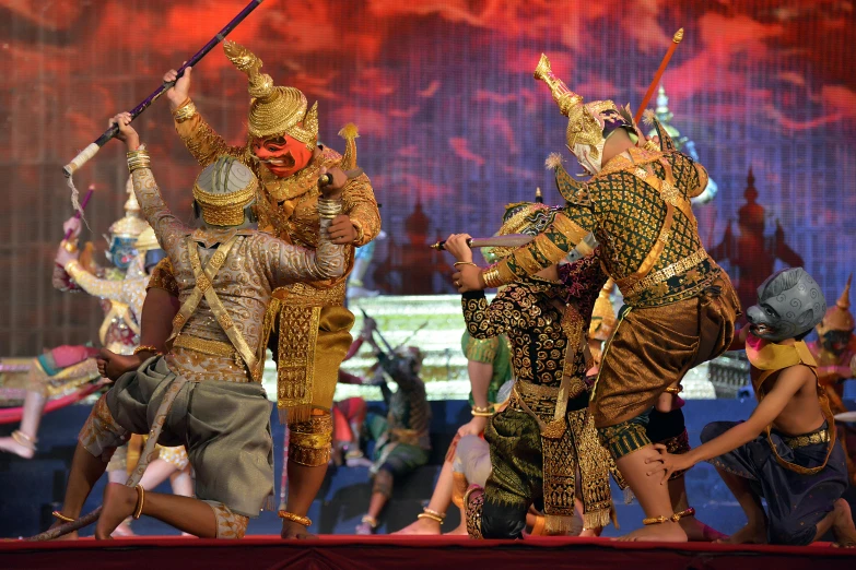 performers in costumes performing on a stage with a crowd