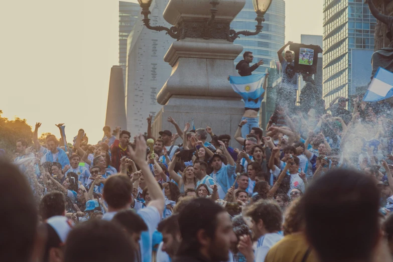 there are several blue and white flags flying from the tower