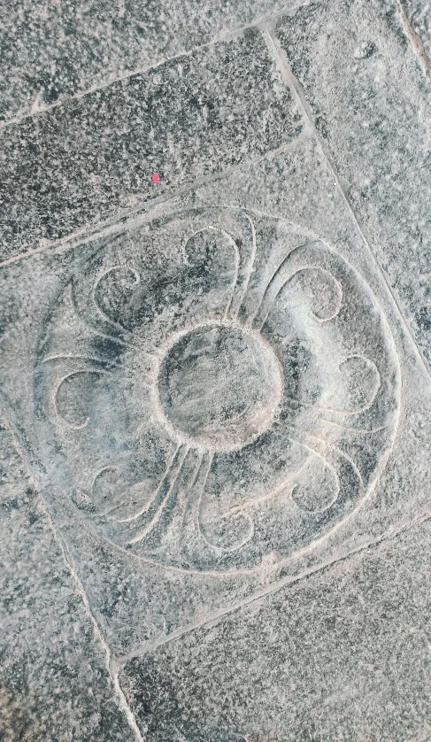 a circular shape in the middle of a desert