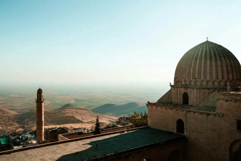 the view from the top of a high building over the desert