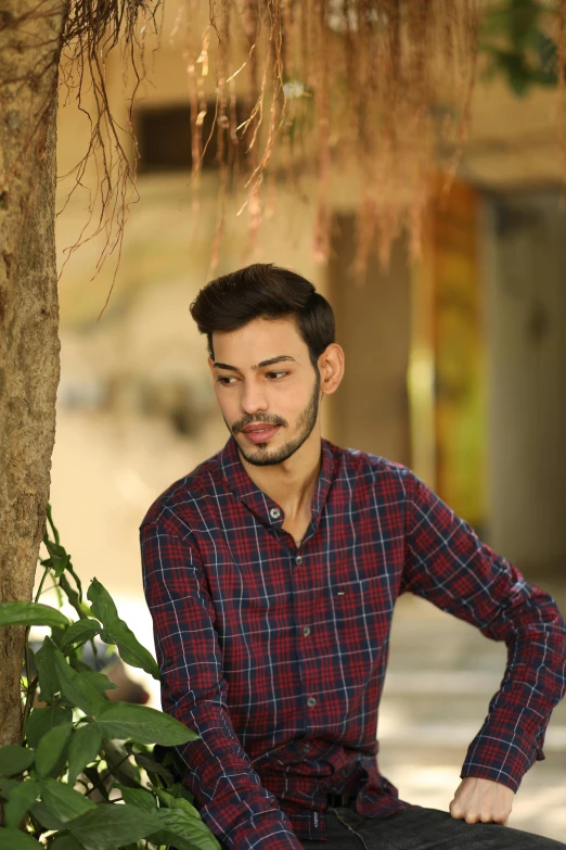 a man with a beard sitting on a bench