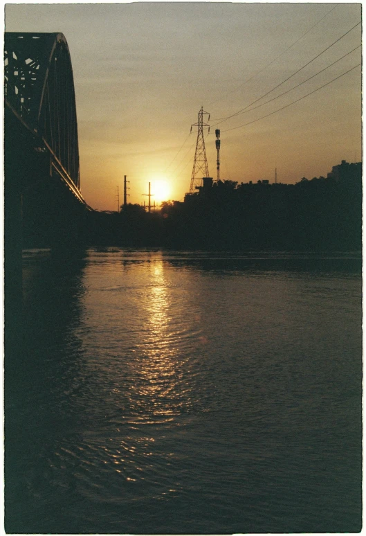 a sun reflecting off the water in a body of water