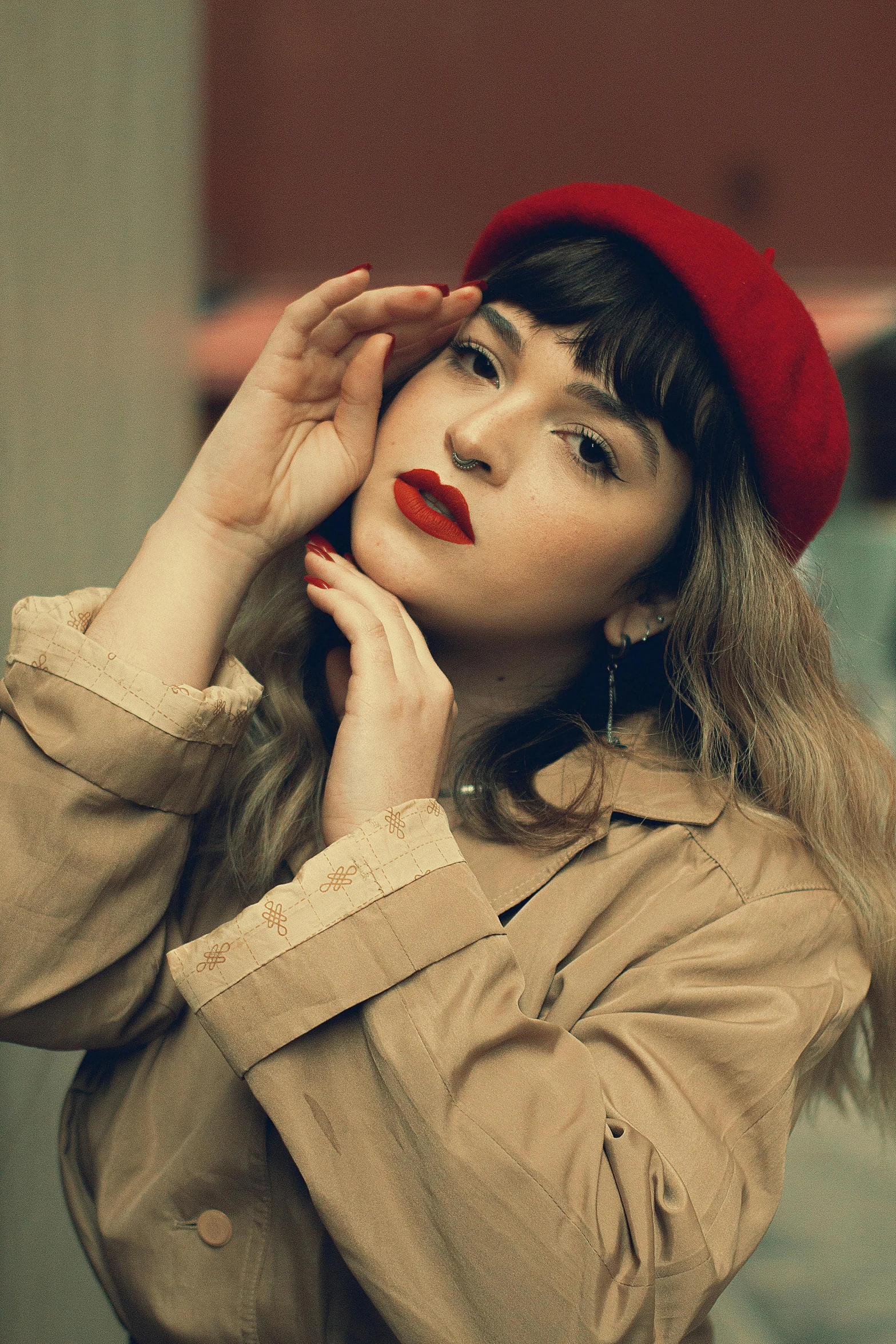 a woman wearing a red beanie and jacket