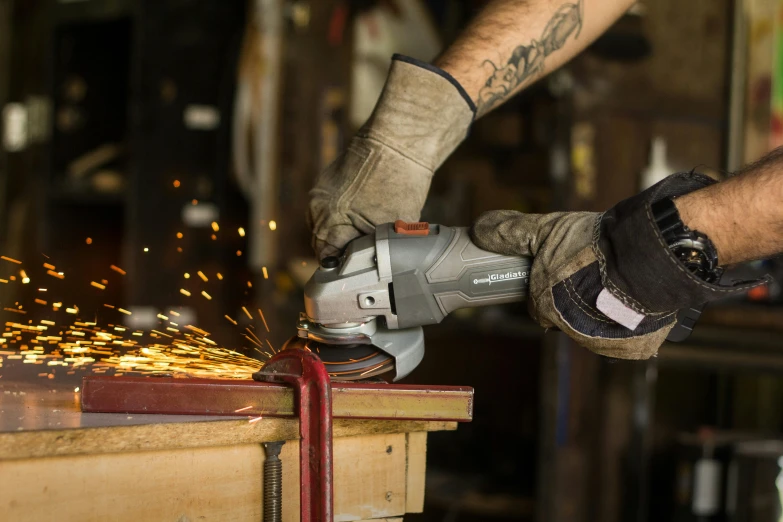 a man using a circular electric grinder