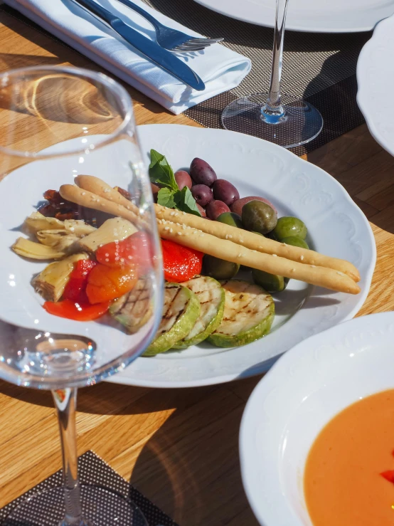 there is a plate with vegetables and bread