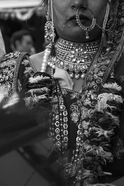 a woman in a black and white po with bead jewelry