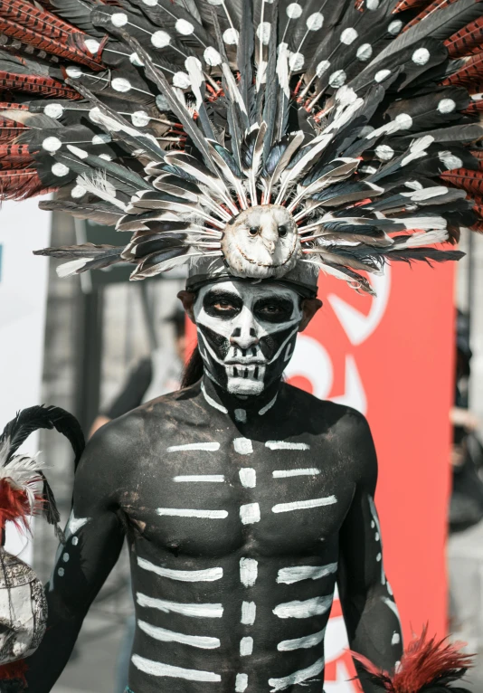 a skeleton like person dressed in white and black