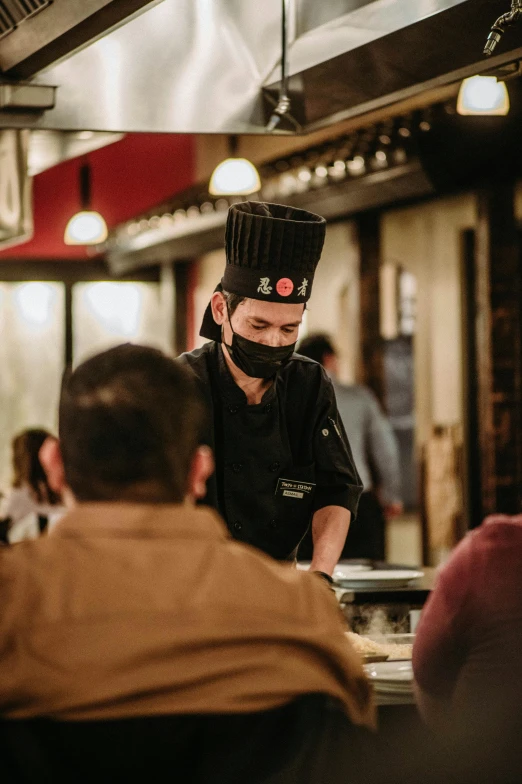 an employee prepares food for customers at a restaurant