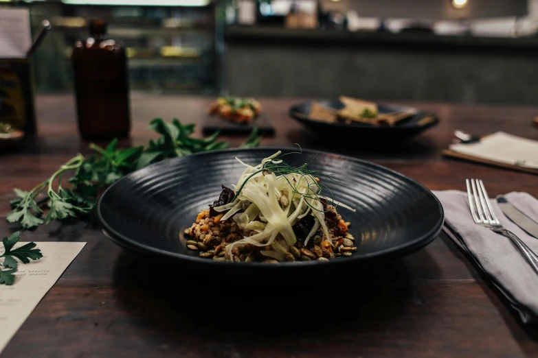 an asian dinner is served on the table