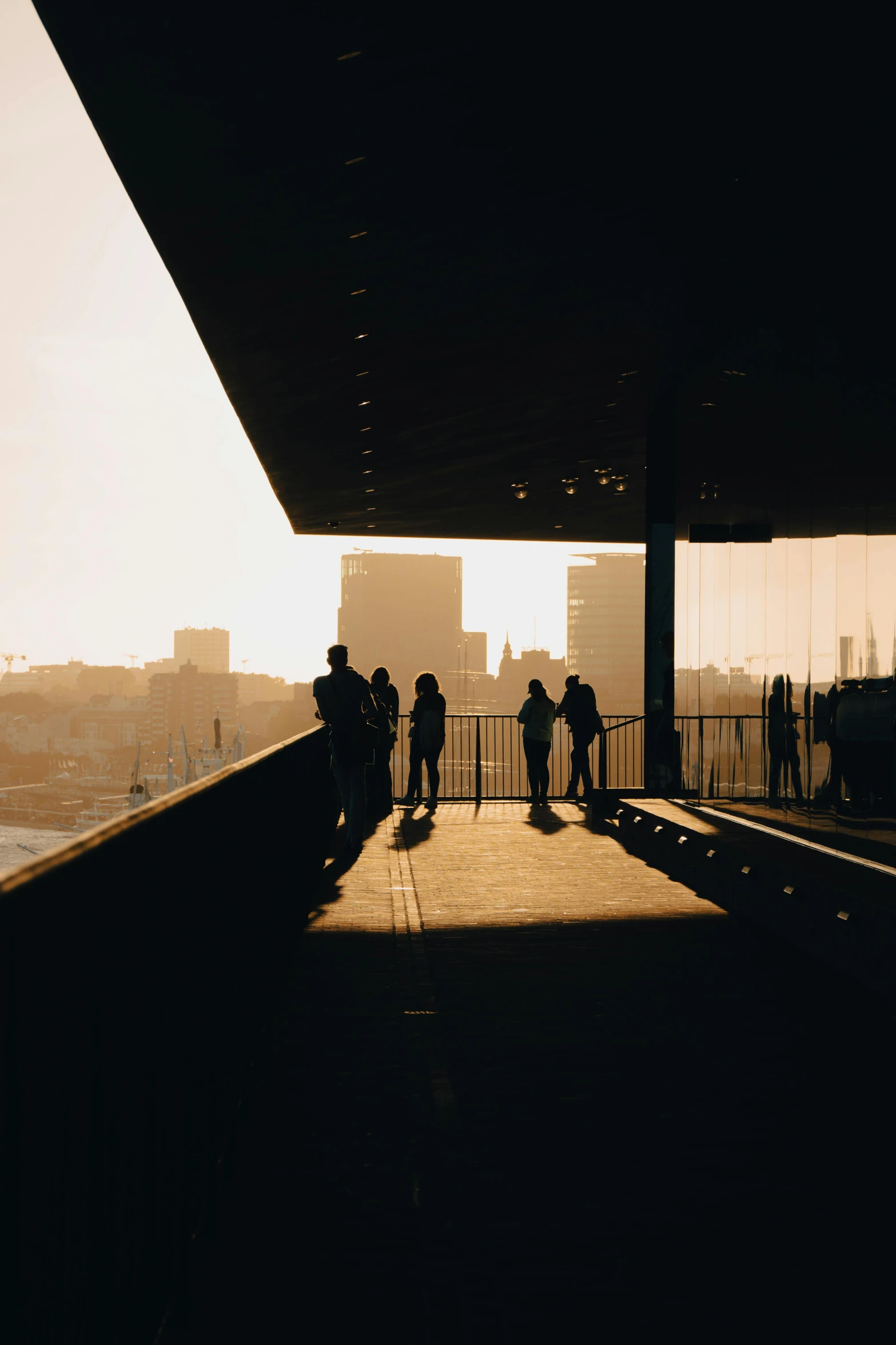 a few people are standing near a large structure