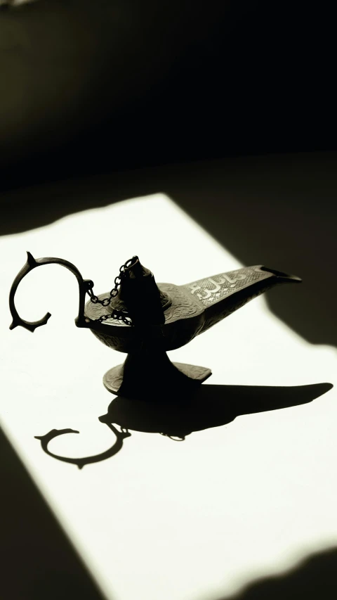 this is the shadow from a piece of furniture that resembles a scissors