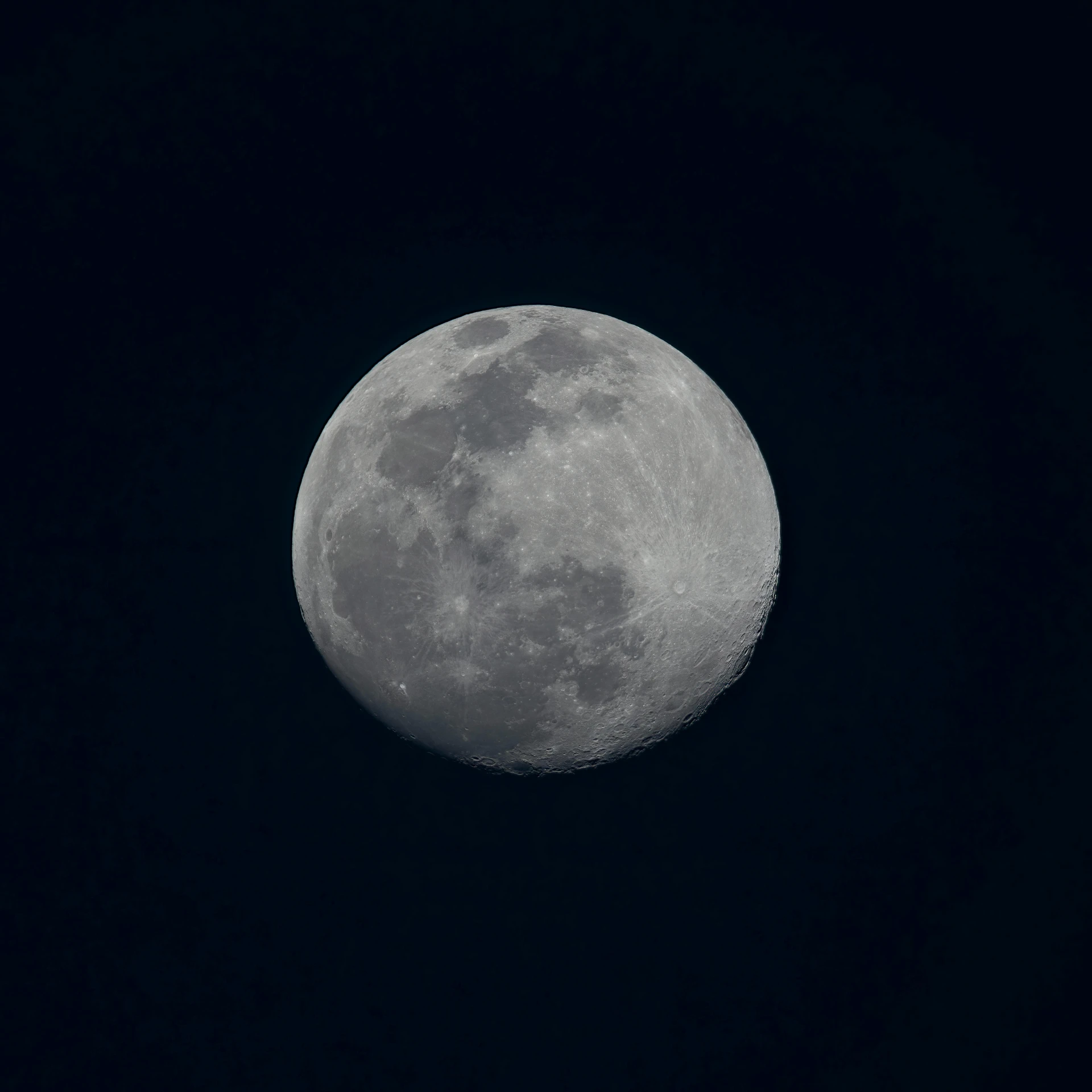 the full moon shines brightly through the dark sky