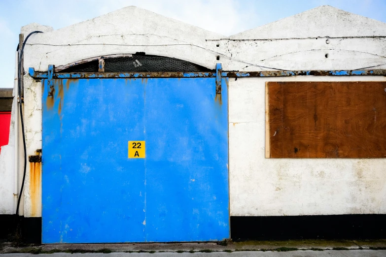 blue door to building on the street side