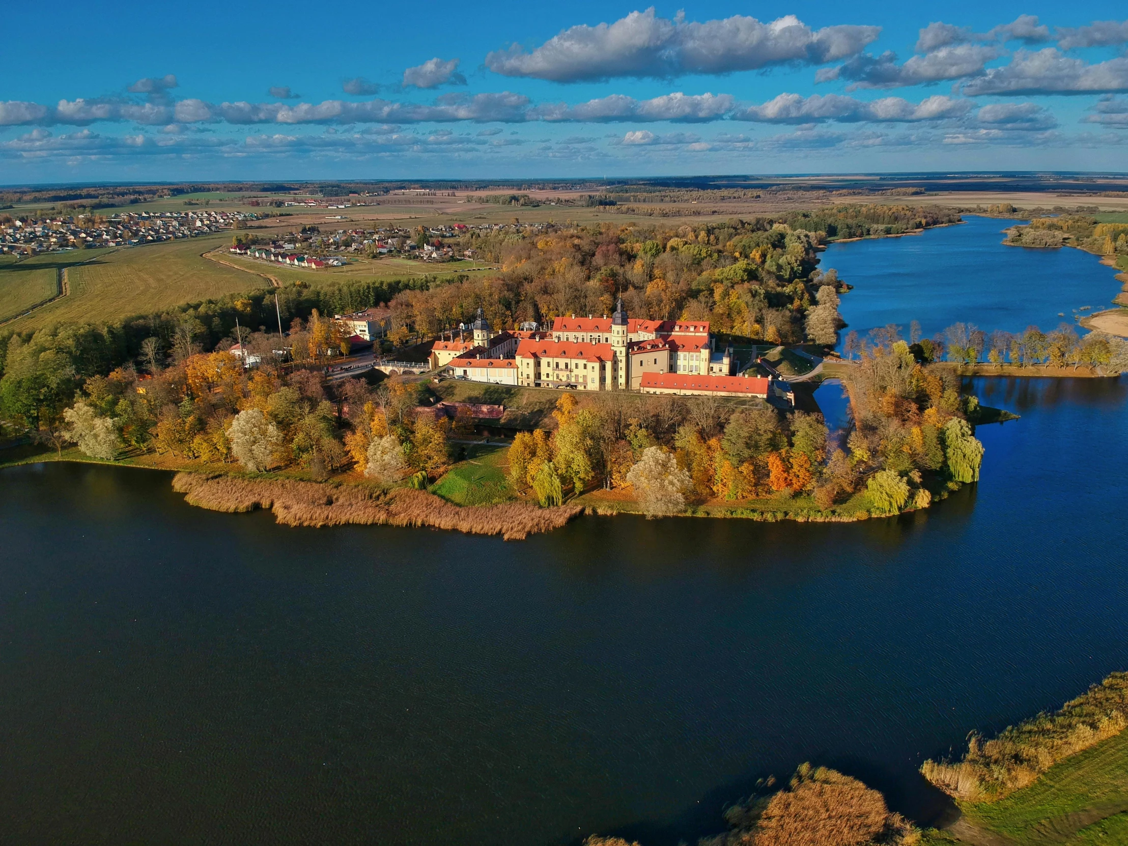 the aerial view of the estate on a lake