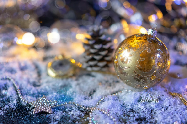 an image of christmas balls in the snow