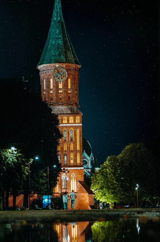 a large building with a tower that has a clock on the side of it