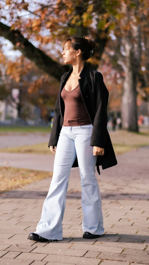 a young lady is walking on a path