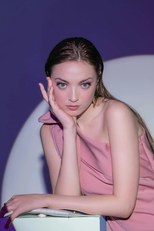 a woman is posing for a picture and wearing a towel