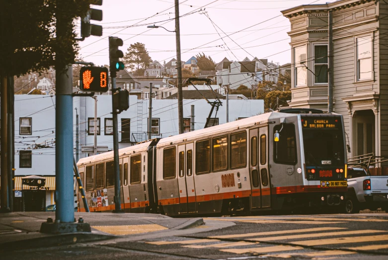 a train is traveling through a city with many buildings