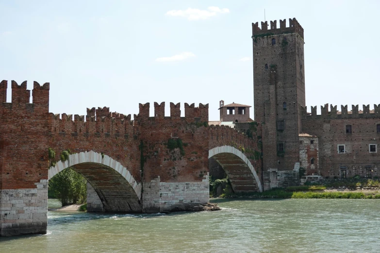 the tall stone castle is by the water