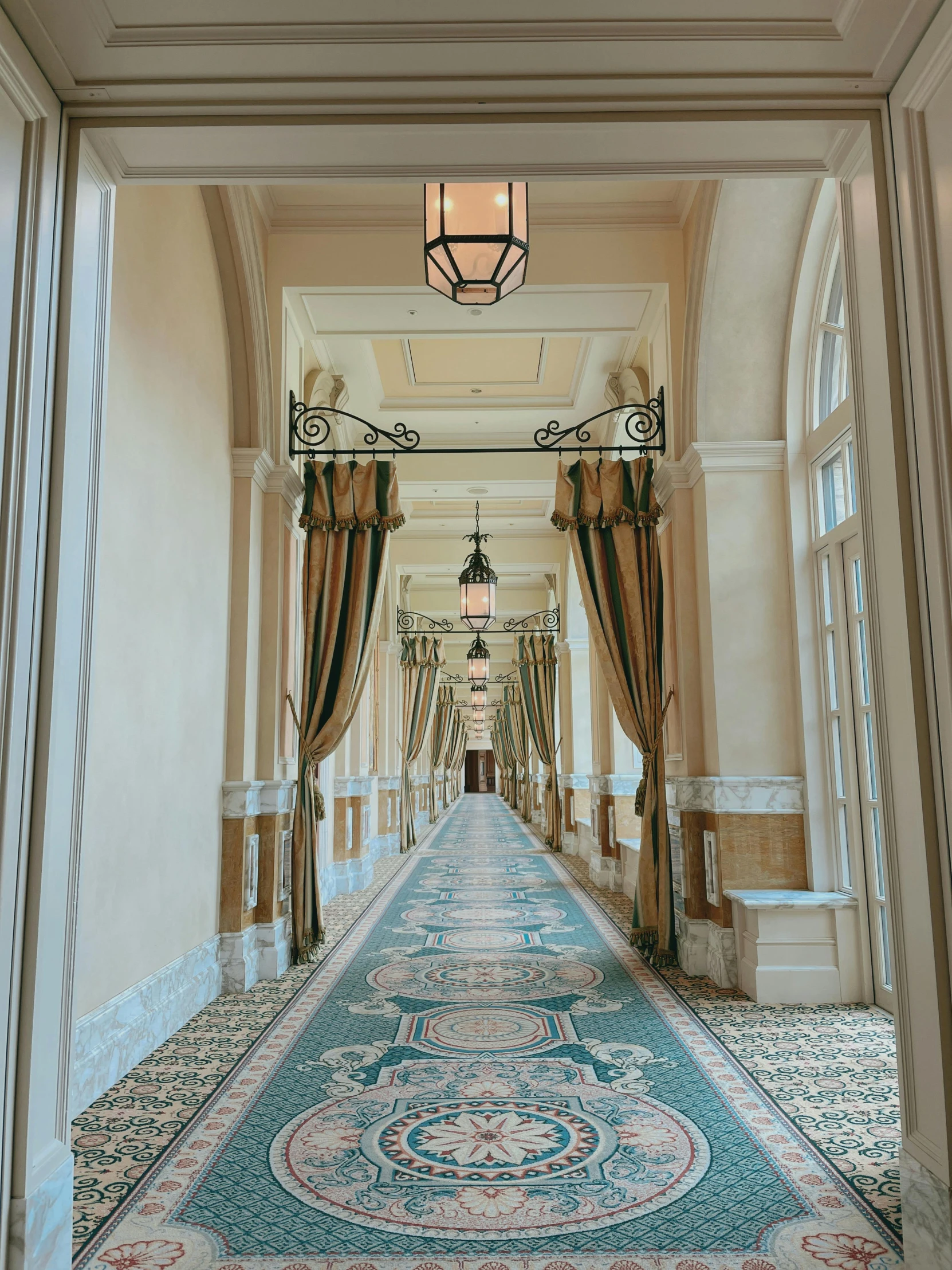 a blue, white and red carpet is seen in a hallway