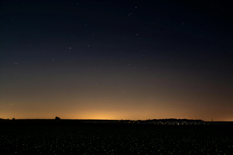 the night sky with bright stars is shining down