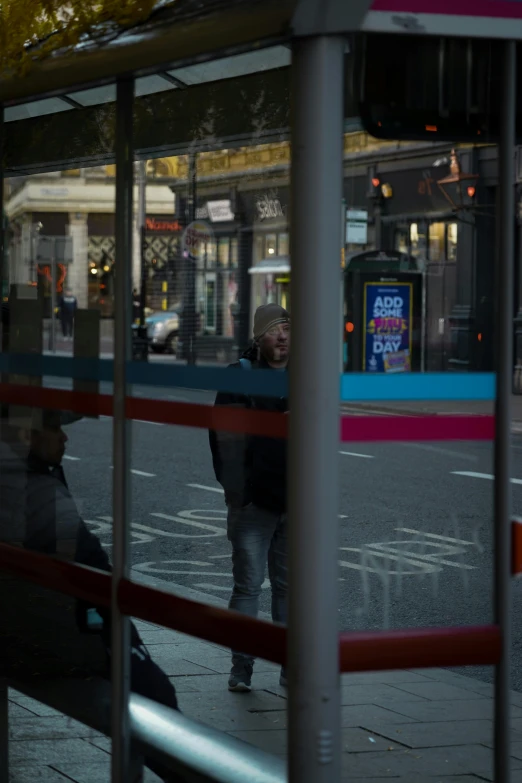 two people walking along side a city street