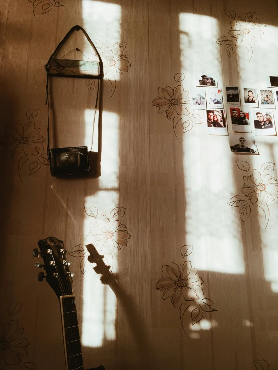 a small guitar and some guitar strings on a table