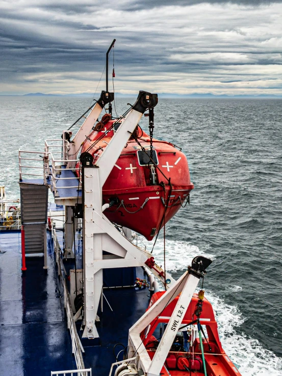 a large red and white boat in the water