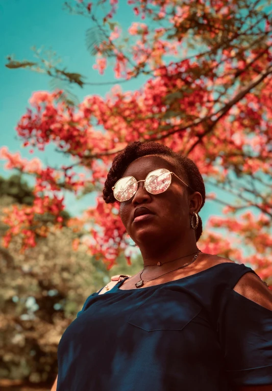 a woman wearing pink flowers with her eyes half closed