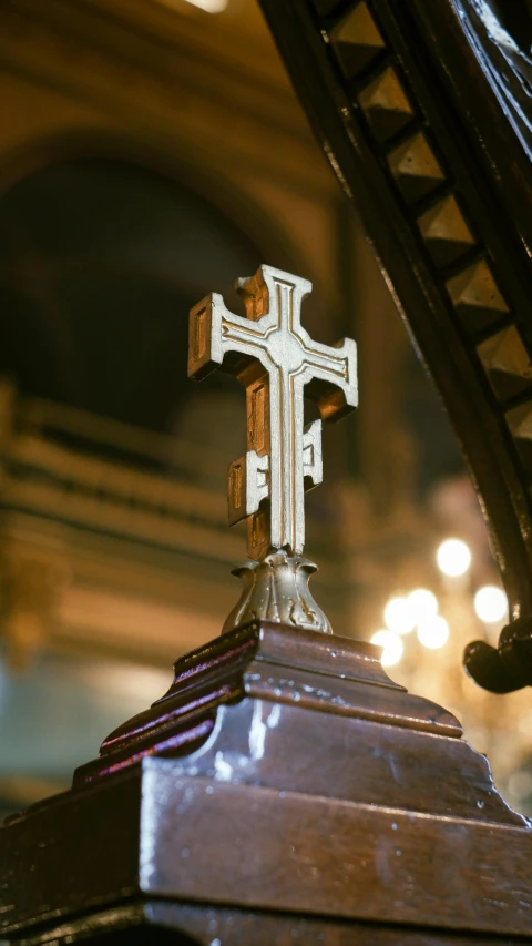 the small cross is on top of the church