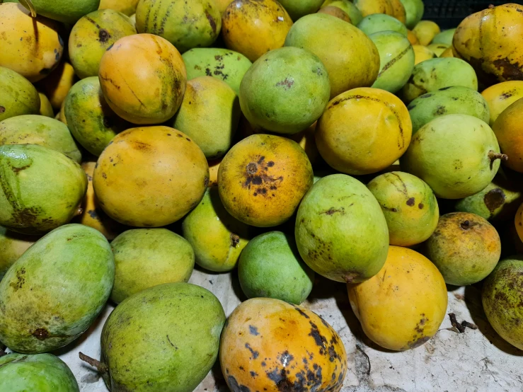 fruit sitting in a bowl all over the ground