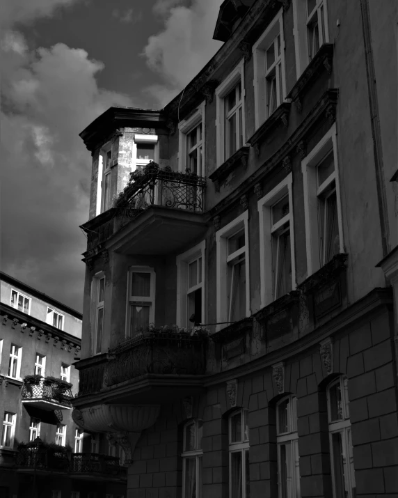 a couple of windows and balconies on a building