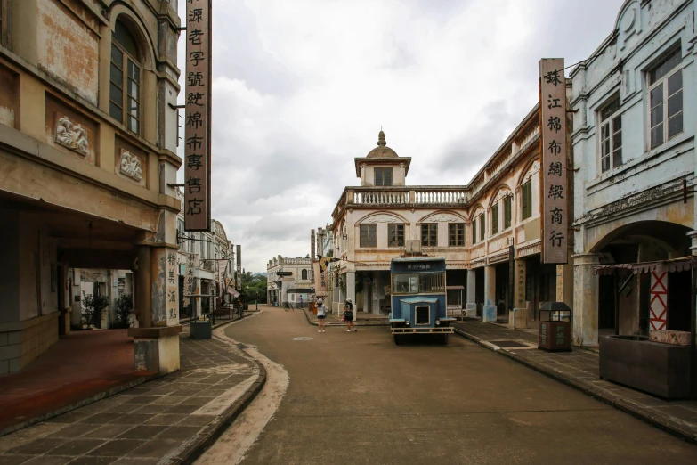 a narrow street in an old town with buildings