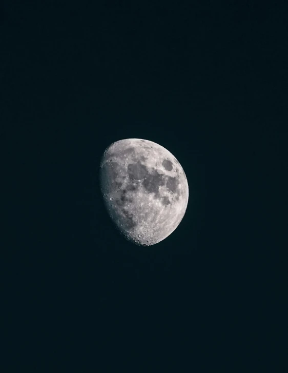 a very large moon on a black sky