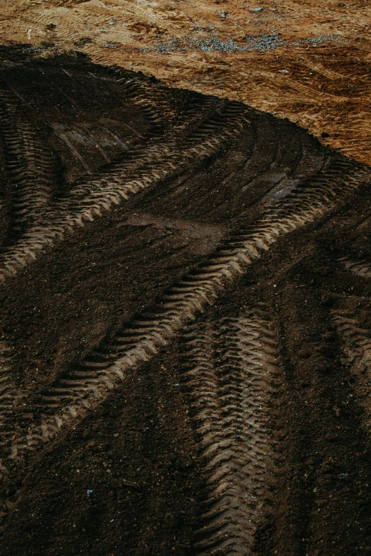 a black and tan rug with the colors of brown and blue